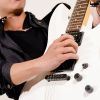 Consejos y ejercicios para prevenir y tratar el dolor de espalda en guitarristas.
